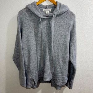Gray long sweater with slits on the side. Nice big hoodie on the back.